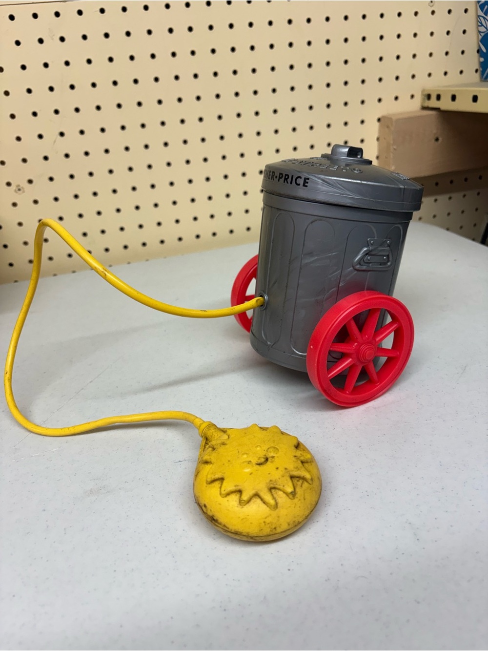 Fisher-Price Gray Pull-Along Trash Can Toy with Red Wheels and Yellow Handle
